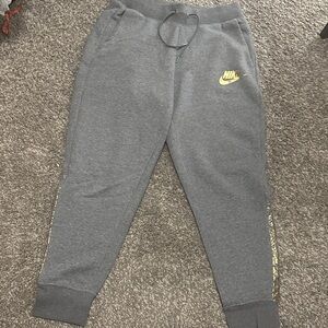 Nike Gray Joggers with gold Logo